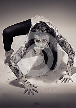 Woman covered in mud