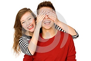 Woman covering boyfriendâ€™s eyes