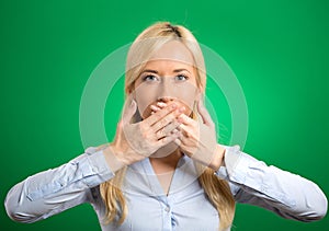 Woman covering closed mouth with hands