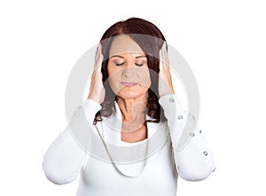 Woman covering ears, closing her eyes