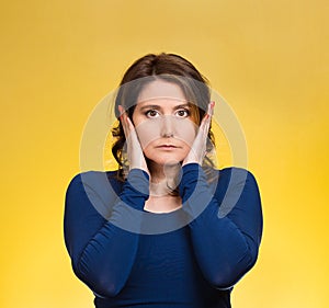 Woman, covering ears. Hear no evil concept