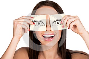 Woman covering eyes with stickers