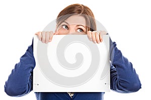 Woman covering face with note card