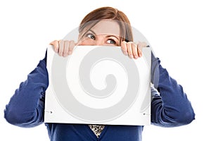 Woman covering face with note card