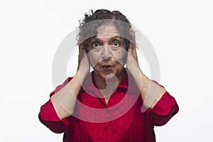 Woman covering her ears, horizontal