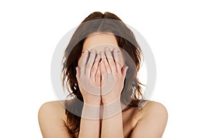 Woman covering her face.