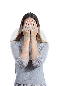 Woman covering her face with both hands