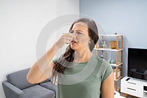 Woman Covering Her Nose From Bad Smell