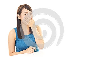 Woman covers her mouth
