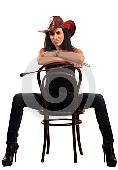 woman in cowboy hat sits on chair