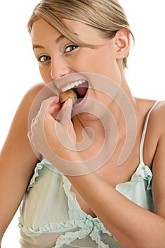 Woman cracking walnut