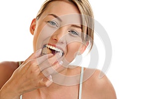 Woman cracking walnut photo