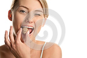 Woman cracking walnut