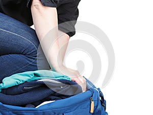 Woman crammed full of clothes and shoulder bag isolated