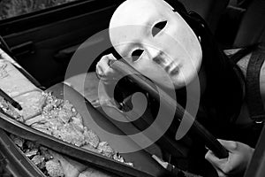 A woman in a crashed car