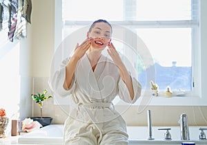 Woman with cream for her face