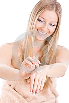 Woman creaming hands