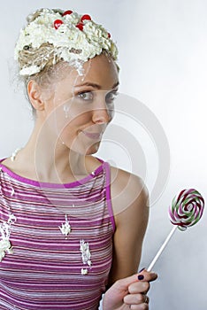 Woman with creamy haicut eating lollipop