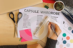 Woman creating a capsule wardrobe