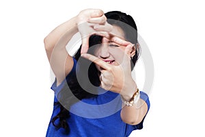 Woman creating a frame with fingers