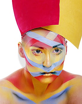 Woman with creative geometry make up, red, yellow, blue closeup