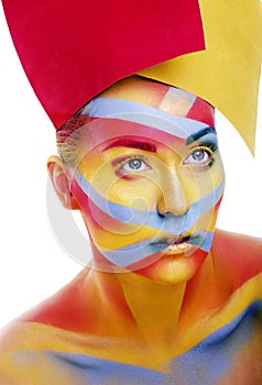 Woman with creative geometry make up, red, yellow, blue closeup