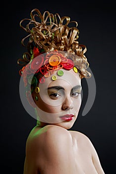 Woman with creativity hairstyle with colored button
