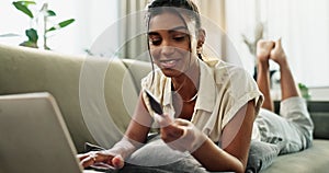 Woman, credit card and laptop on sofa with cybersecurity check, fintech app and banking info in home. Girl, computer and