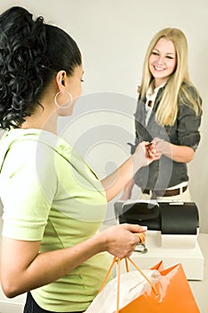 Woman with Credit Card at Register