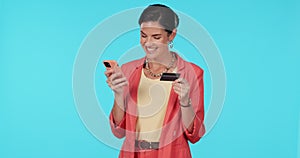 Woman, credit card and smartphone, online shopping and fintech, happy with bank app and payment on blue background