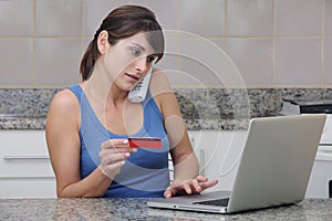 Woman with creditcard and laptop photo