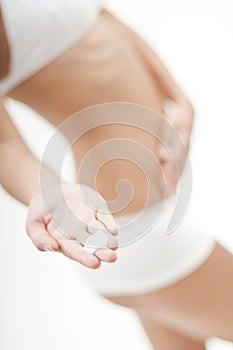 Woman with creme on her hand