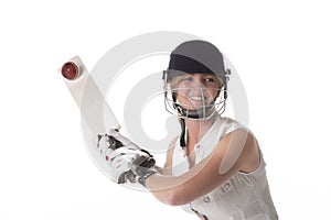 Woman cricketer hitting a leather ball