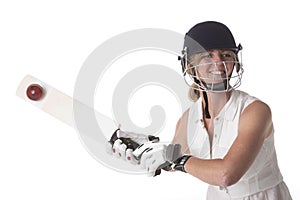 Woman cricketer hitting a leather ball