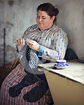 Woman Crocheting Blanket