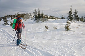 A woman cross country skiing in the mountain