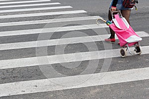 Woman crosses an unregulated crosswalk