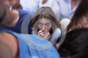 Woman, crowd and trapped with social anxiety at work with stress, scared and overthinking with concern. Female person