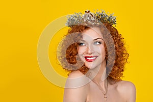 Woman in crown looking to side smiling happy