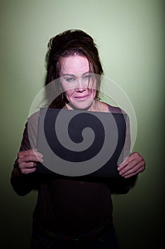 Woman crying in mugshot