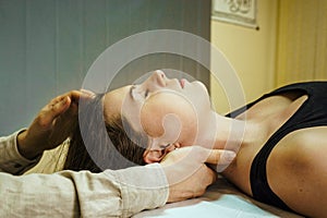 a woman at a CST treatment session, Osteopathic Manipulation and CranioSacral Therapy 4 photo