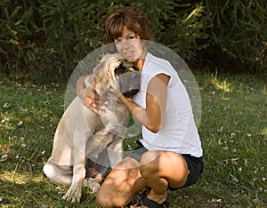 Woman Cuddling Dog