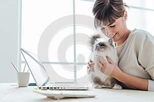 Woman cuddling her cat