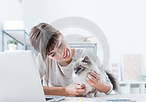 Woman cuddling her cat