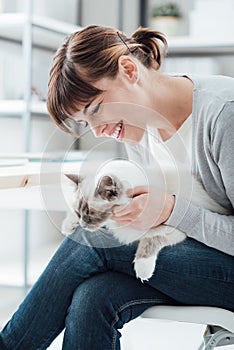 Woman cuddling her lovely cat