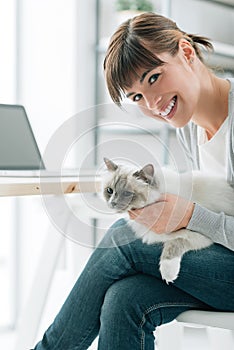 Woman cuddling her lovely cat