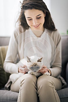 Woman cuddling her lovely cat