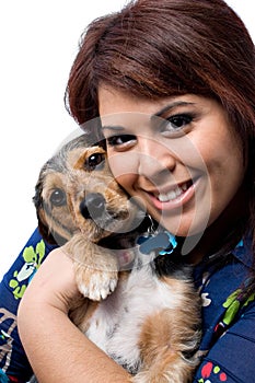 Woman Cuddling a Puppy