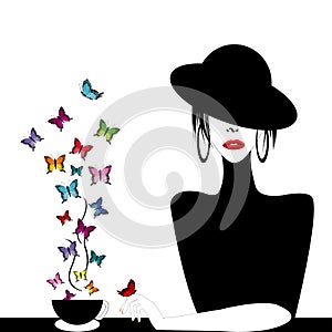 Woman with a cup of buterflies flying
