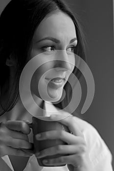 Woman with cup of coffee.